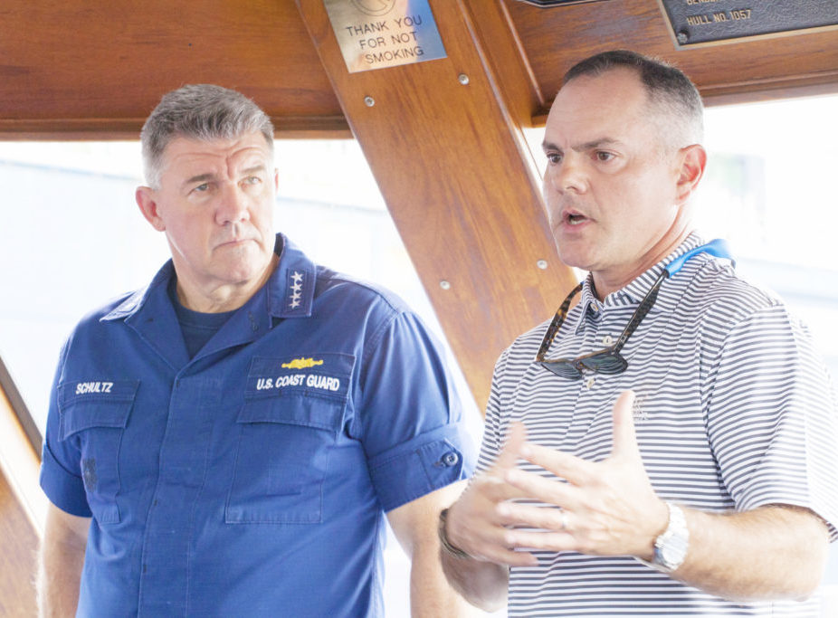 USCG and captain on a boat bridge